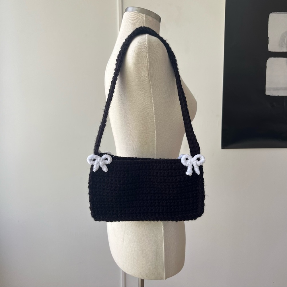 Black crochet shoulder bag with white bows
